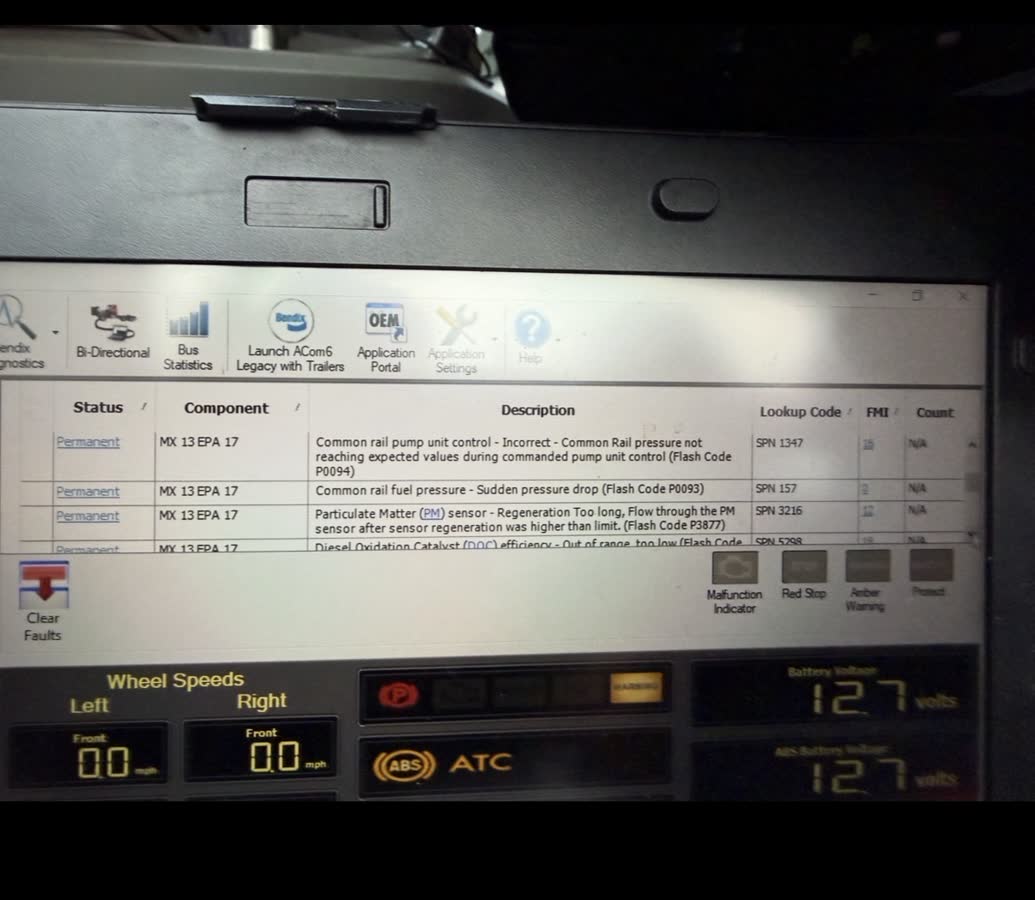 Paccar MX engine fault code diagnostics on laptop